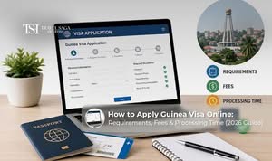 Traveller applying for Guinea visa online with passport, laptop, and travel documents
