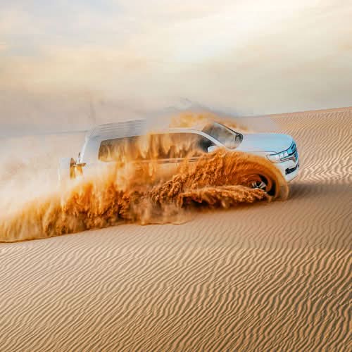 Desert Safari Dubai with dune bashing, camel rides, and sunset views