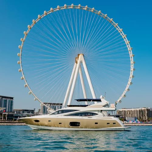 Luxury yacht cruising in Dubai Marina with stunning skyline views