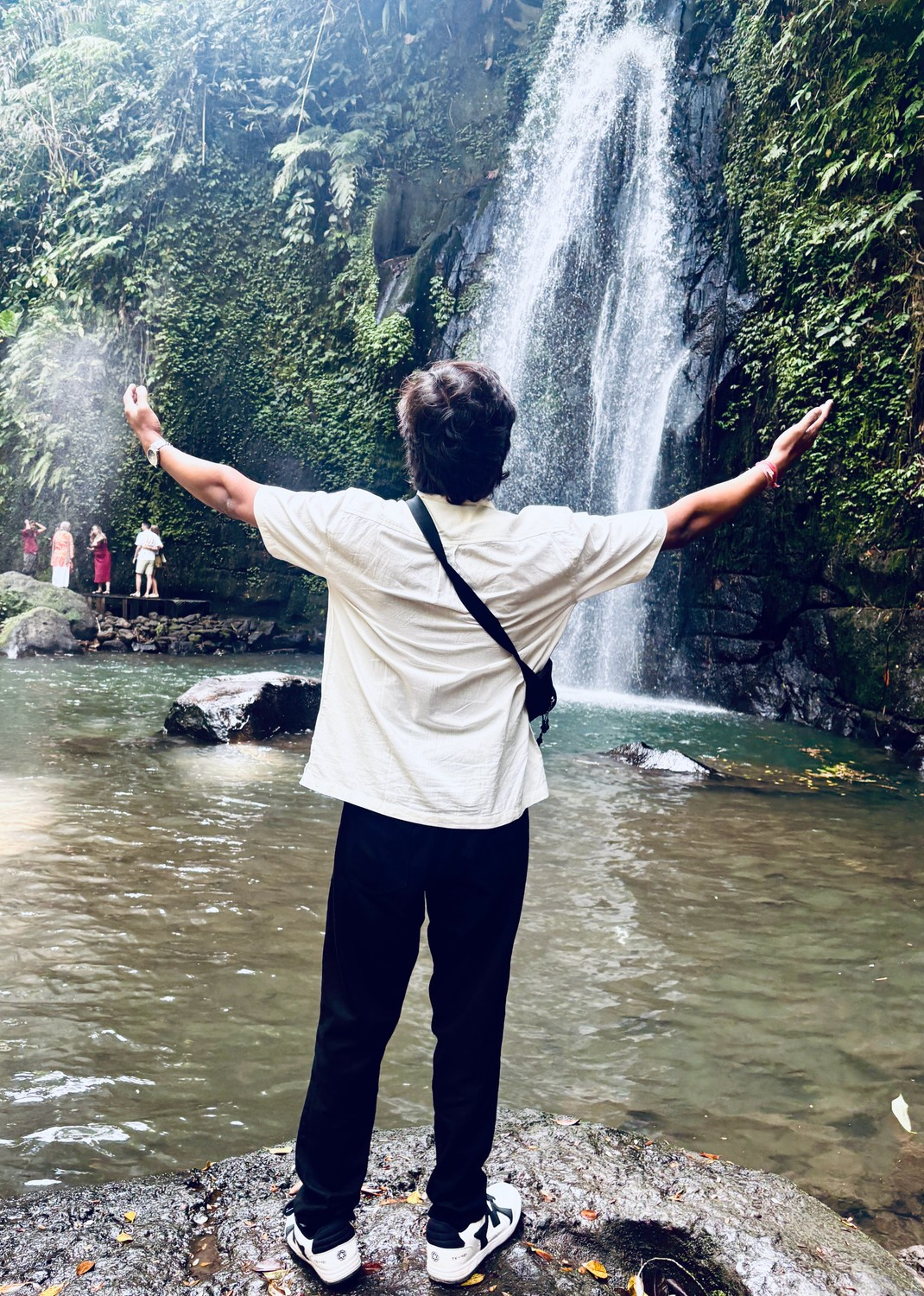 Harshit Sharma exploring a beautiful waterfall during his Bali holiday from India