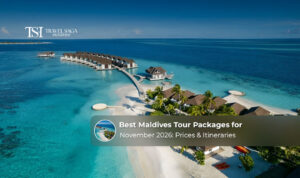 Tropical Maldives resort with overwater villas, turquoise water, and a scenic beach setting.