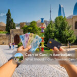 Indian travellers using cash and bank cards to manage expenses while exploring Azerbaijan's cities and tourist attractions.